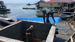 Pembongkaran Papan Mal Tandai Kemajuan Pembangunan Manunggal Air Bersih TMMD Ke-129 di Desa Umbele
