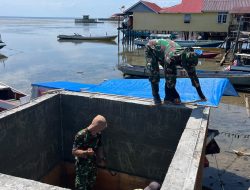 Pembongkaran Papan Mal Tandai Kemajuan Pembangunan Manunggal Air Bersih TMMD Ke-129 di Desa Umbele