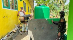 Satgas TMMD Ke-129 Lanjutkan Pengecatan Tandon Air di SDN Umbele Desa Pulau Dua