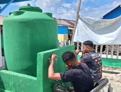 Satgas TMMD Lukis Identitas TMMD di Lokasi Manunggal Air Bersih